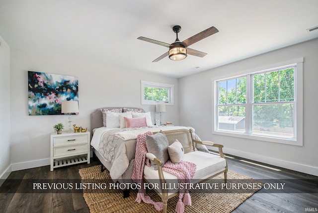 bedroom featuring ceiling fan and dark wood-type flooring