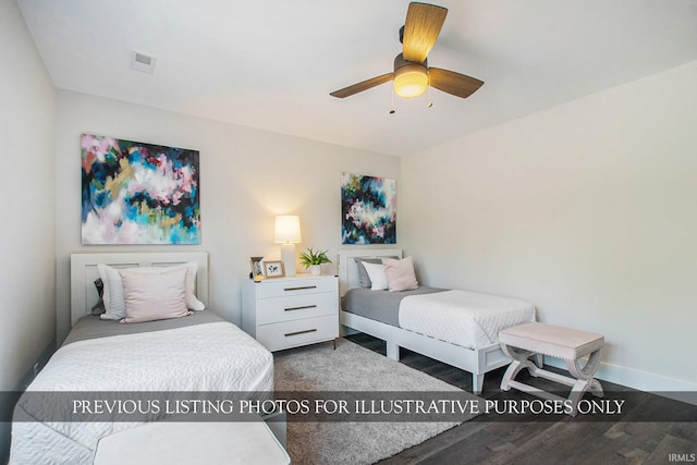 bedroom featuring dark hardwood / wood-style flooring and ceiling fan