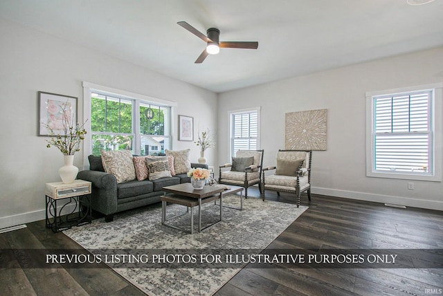 living room with ceiling fan and dark wood-type flooring