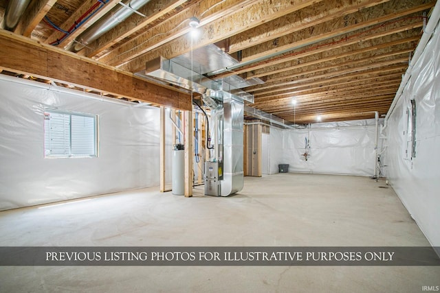 basement featuring heating unit and water heater