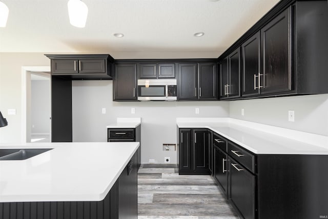 kitchen featuring light wood-type flooring and sink