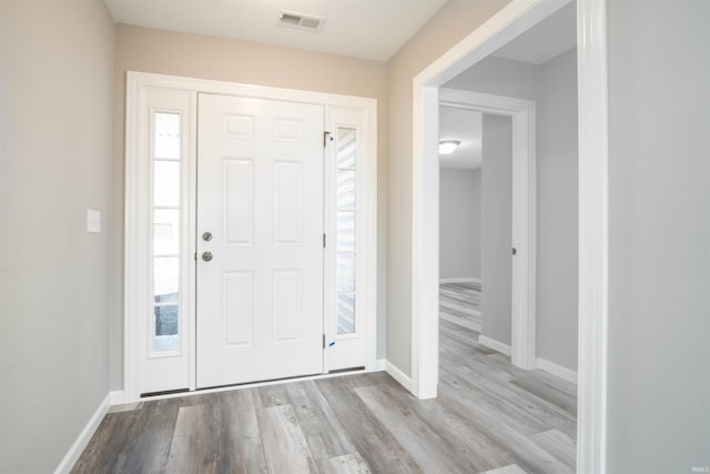 foyer with light wood-type flooring