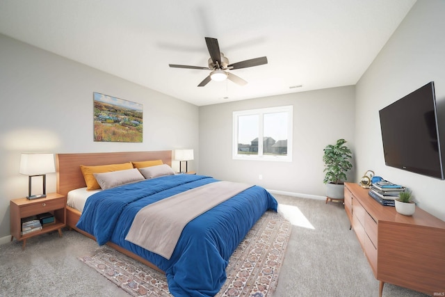 bedroom with ceiling fan and carpet flooring