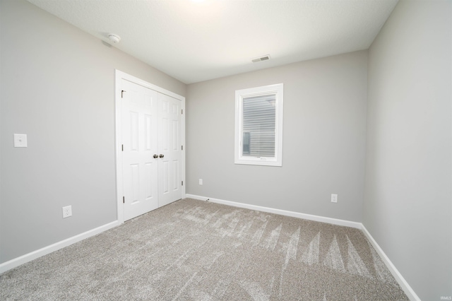 spare room featuring carpet flooring