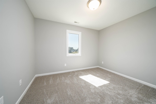 unfurnished room with carpet flooring