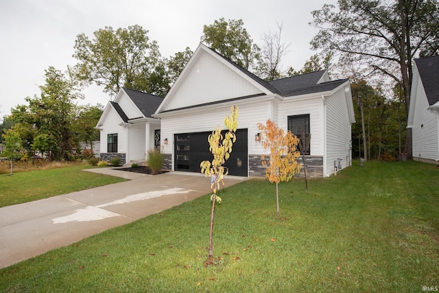 view of front of house featuring a front yard and a garage