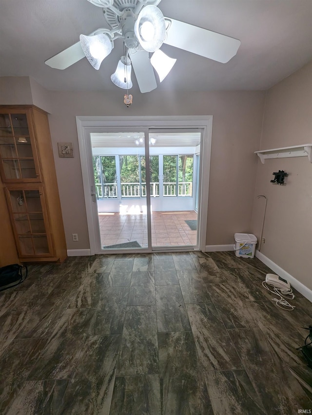 unfurnished living room featuring ceiling fan