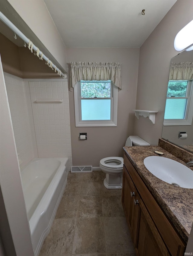 full bathroom with vanity, toilet, and washtub / shower combination