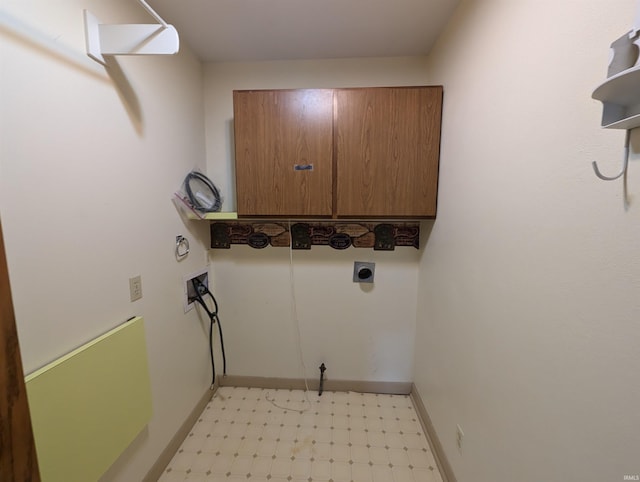 laundry room featuring cabinets, electric dryer hookup, and hookup for a washing machine