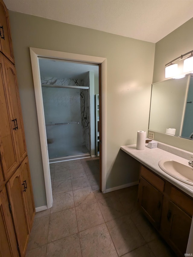 bathroom with vanity, tile patterned floors, and an enclosed shower