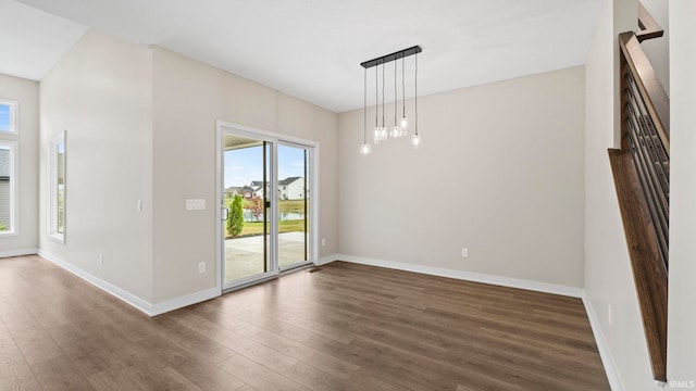 spare room with dark wood-type flooring