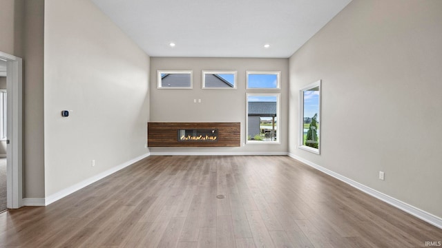 unfurnished living room featuring wood-type flooring