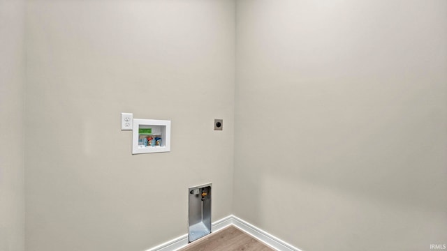 laundry area with hookup for a washing machine, electric dryer hookup, and hardwood / wood-style flooring