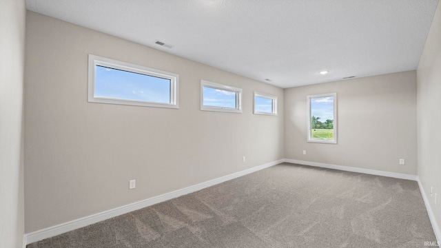 unfurnished room featuring carpet flooring