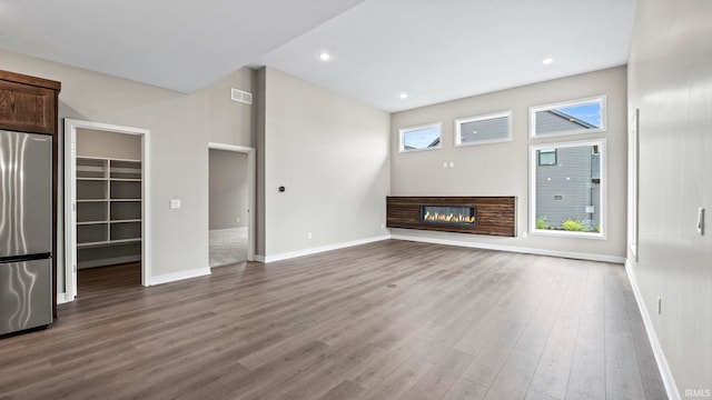 unfurnished living room with hardwood / wood-style flooring