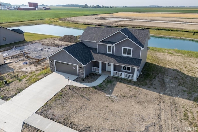 bird's eye view featuring a water view and a rural view