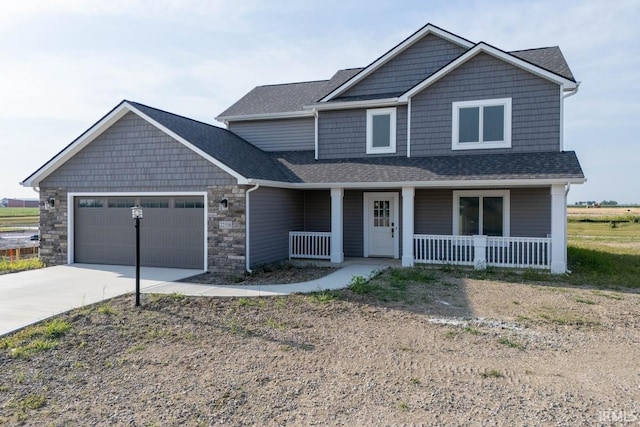 craftsman inspired home with covered porch and a garage