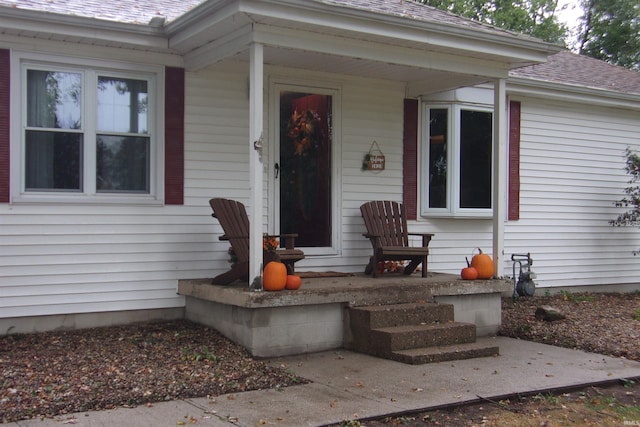 doorway to property featuring covered porch