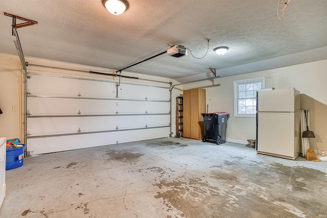 garage featuring a garage door opener and white fridge