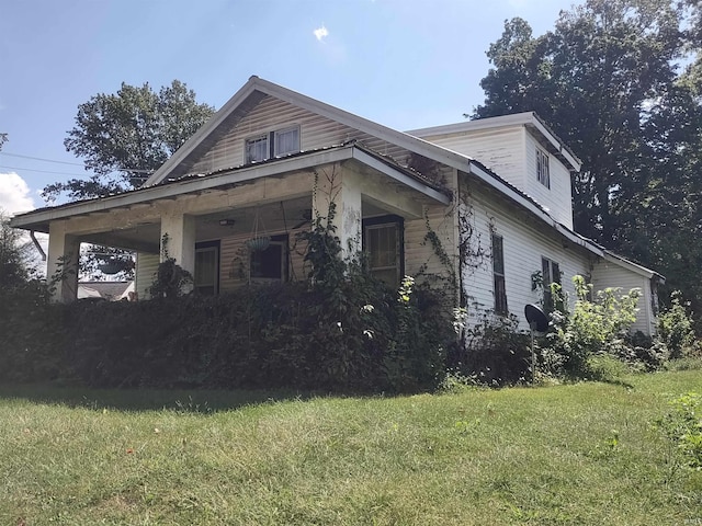 view of home's exterior featuring a lawn