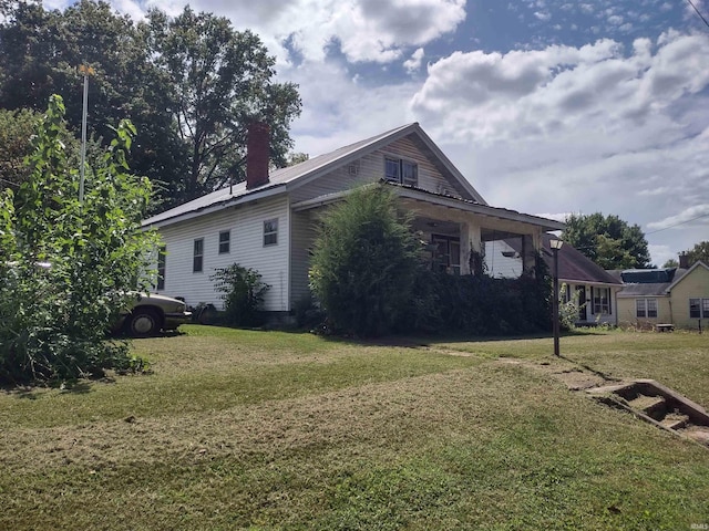 view of home's exterior with a lawn