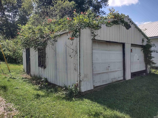 garage with a lawn