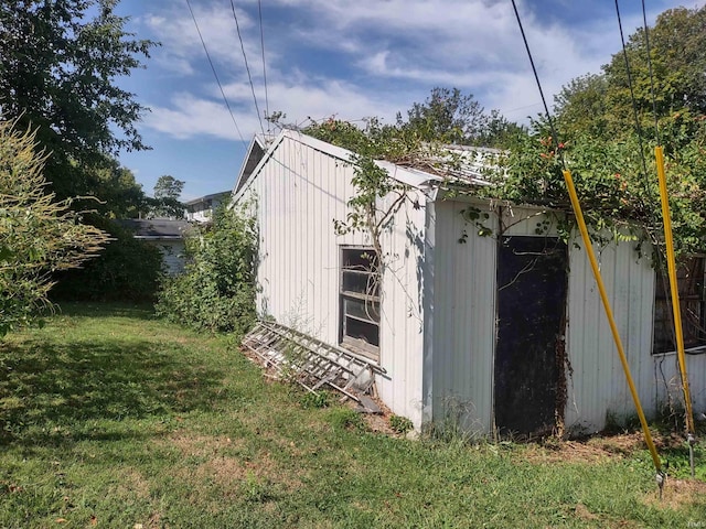 view of outdoor structure with a lawn