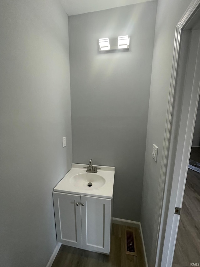 bathroom with wood-type flooring and vanity