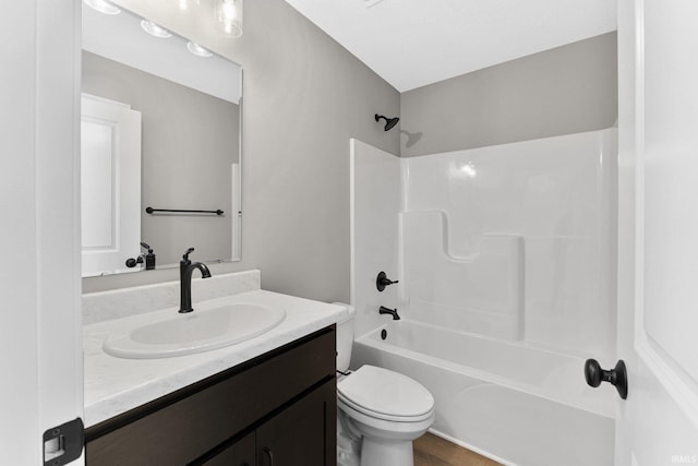 full bathroom with shower / washtub combination, vanity, and toilet