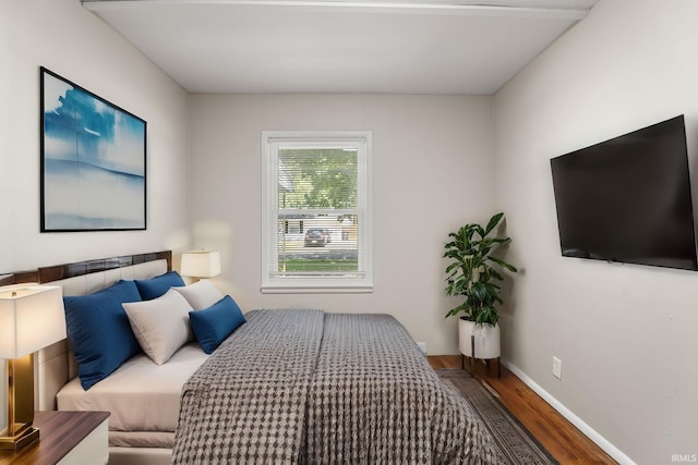 bedroom featuring dark hardwood / wood-style flooring