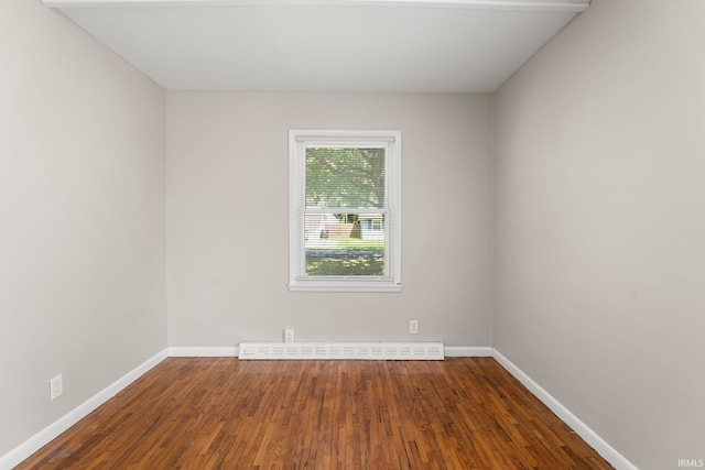 spare room with hardwood / wood-style floors