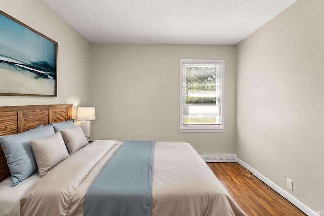 bedroom with hardwood / wood-style floors