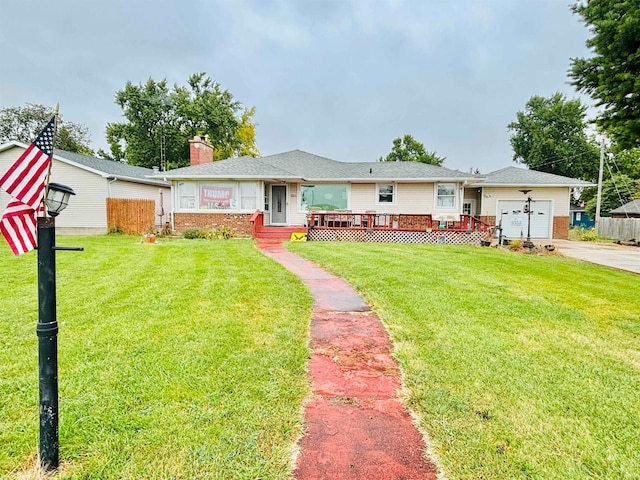 single story home featuring a front lawn and a garage