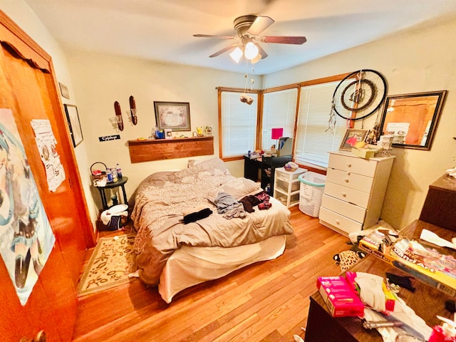 bedroom featuring light wood-type flooring and ceiling fan