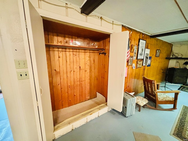 mudroom with wooden walls