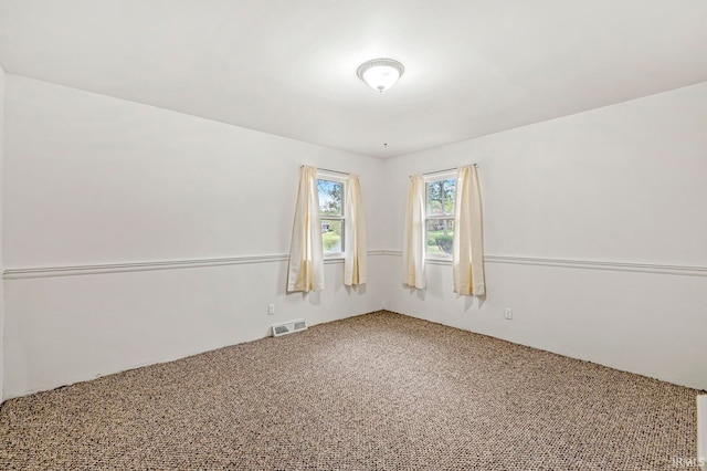 spare room featuring carpet floors