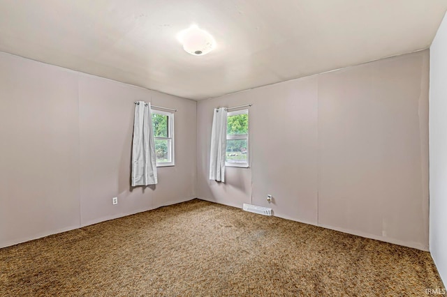 spare room featuring carpet flooring