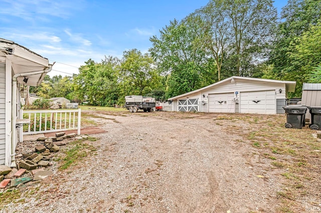 view of yard with an outdoor structure and a garage