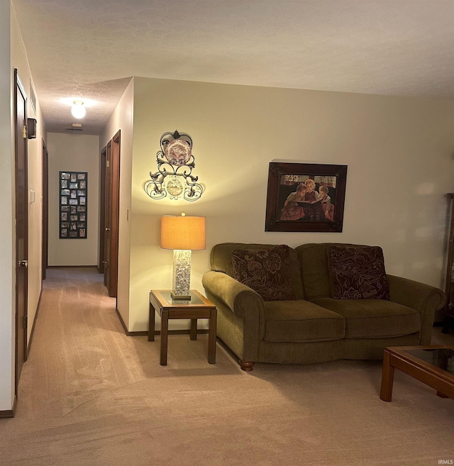 living room with light colored carpet and a textured ceiling