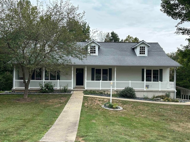 view of front facade with covered porch and a front yard