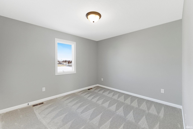 unfurnished room featuring carpet flooring