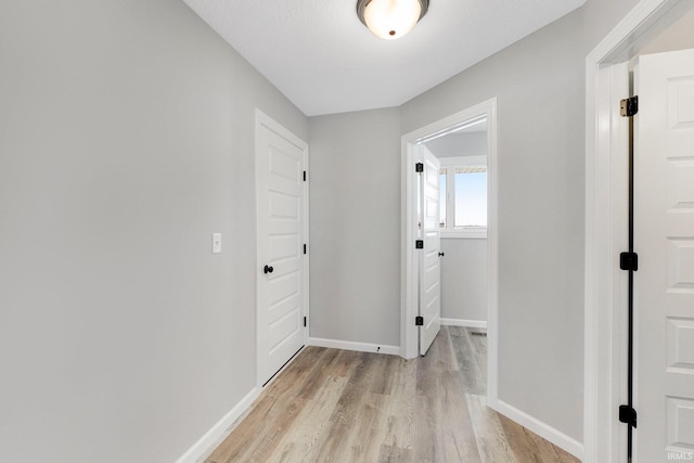 hallway featuring light hardwood / wood-style flooring