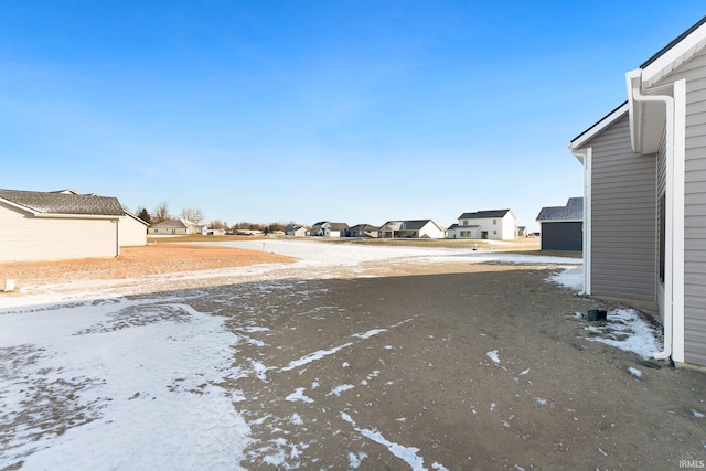 view of yard layered in snow