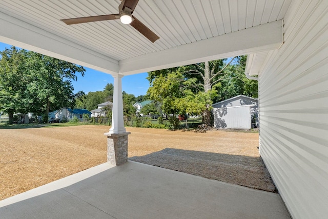 view of patio featuring a shed and ceiling fan