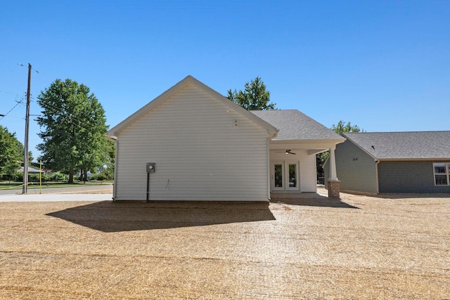 rear view of house featuring french doors