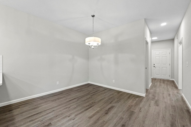 empty room with dark hardwood / wood-style floors