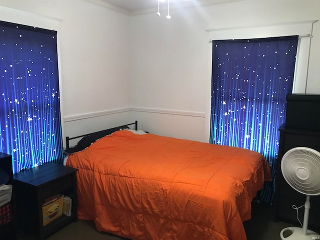 bedroom with ornamental molding