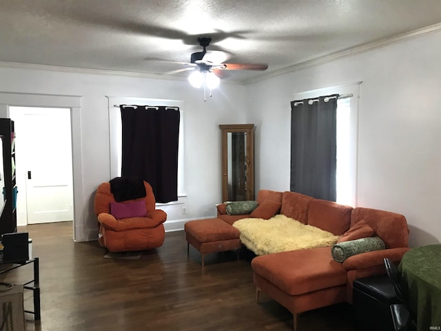 living room with ceiling fan, dark wood-type flooring, and crown molding