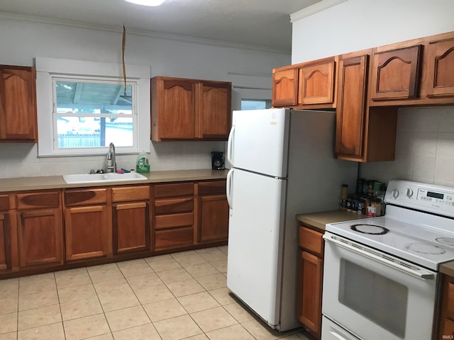 kitchen featuring light tile patterned floors, sink, white appliances, tasteful backsplash, and crown molding