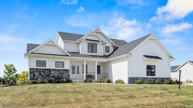 craftsman house with a porch and a front yard